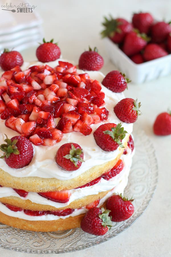 Strawberry Layer Cake topped with strawberries.