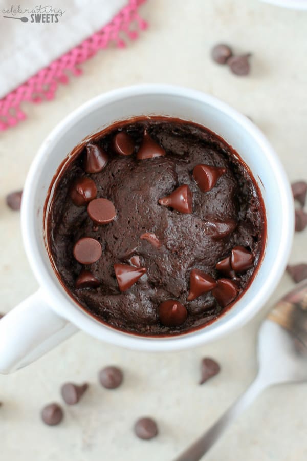 Brownie in a mug topped with chocolate chips. 