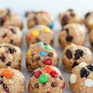 Energy bites topped with raisins, M&M's and dried fruit.