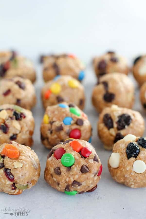 Energy bites topped with raisins, M&M\'s and dried fruit. 