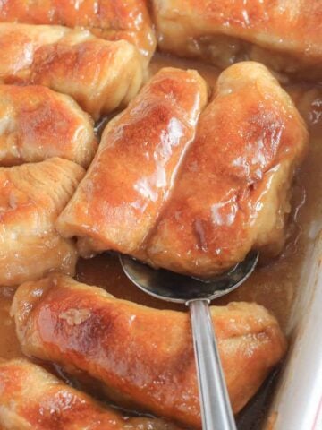 Apple dumplings in a baking dish.