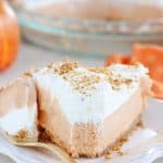 Slice of Cream Cheese Pumpkin Pie on a white plate.