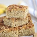 Squares of banana bread stacked on top of each other.