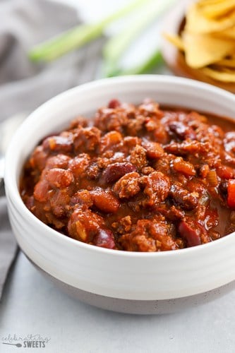 White bowl filled with beef chili.