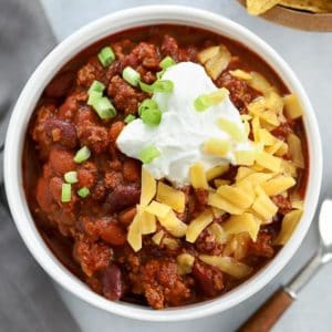 Beef Chili topped with cheese, sour cream and green onion