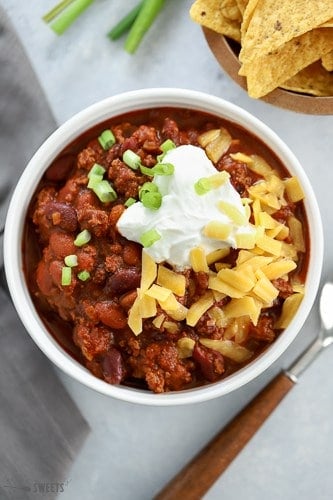 Beef Chili topped with cheese, sour cream and green onion