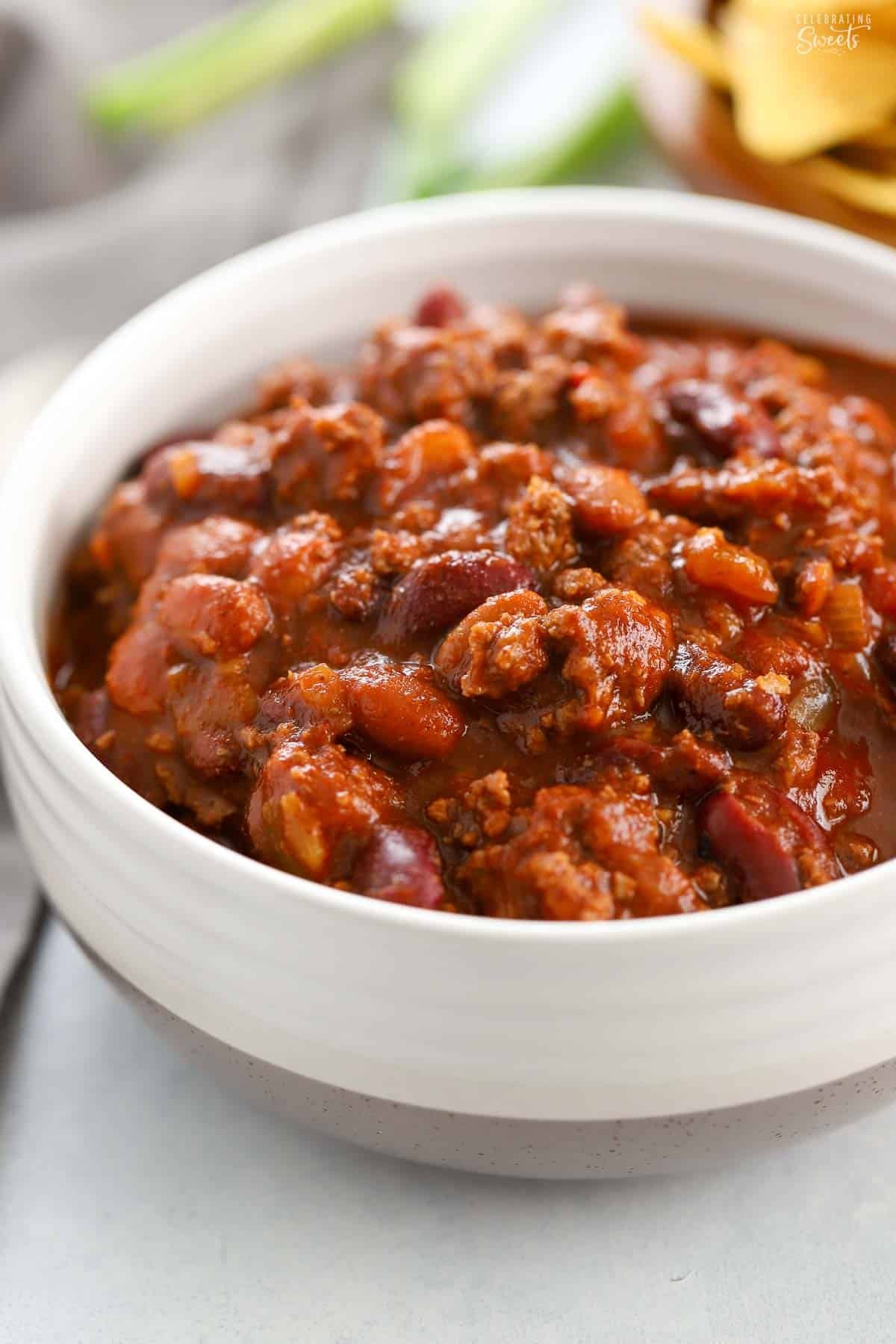 A white bowl filled with beef chili.