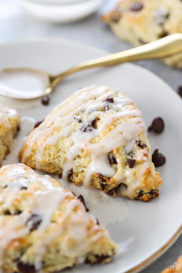 Chocolate Chip Scones drizzled with white icing.