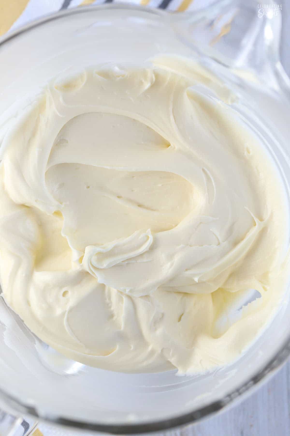 Cream cheese frosting in a glass bowl