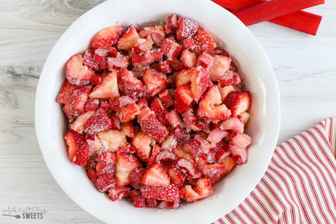 Strawberries, tossed with sugar and flour in a baking dish.