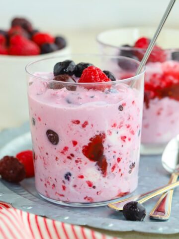 Berries mashed with ice cream in a glass.