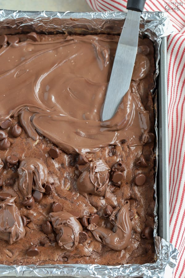 Pan of brownies with chocolate frosting.