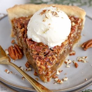 Maple Pecan Pie topped with vanilla ice cream.