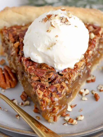 Maple Pecan Pie topped with vanilla ice cream.