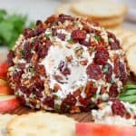 Cheese ball coated with dried cherries and pecans.