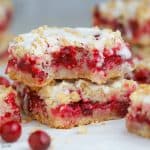 Two Cranberry Bars on parchment paper.