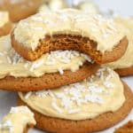 Three molasses cookies topped with frosting.