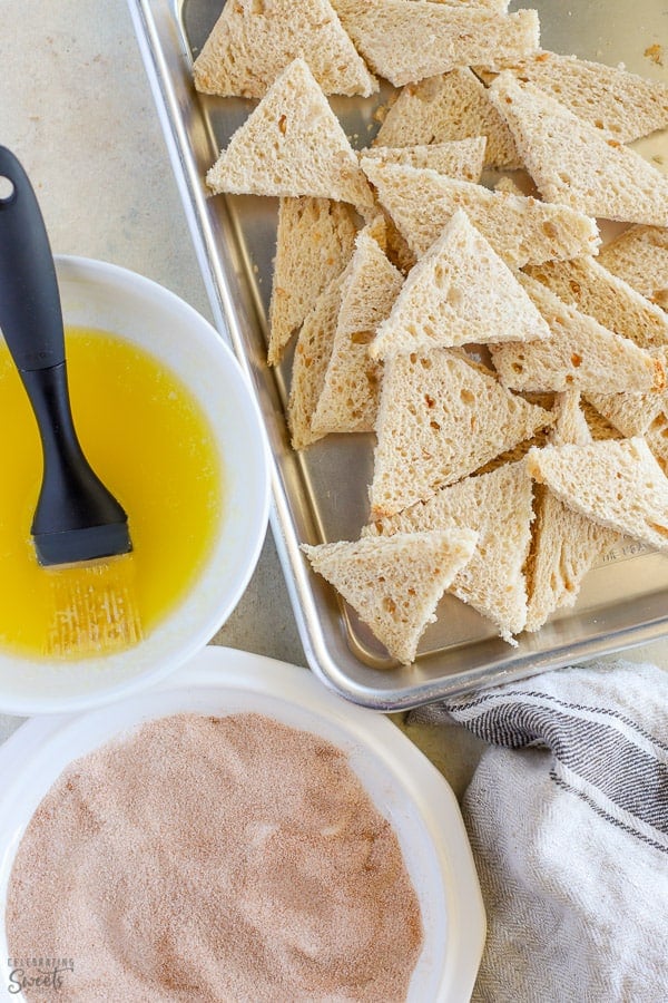 Pieces of bread, melted butter and cinnamon sugar for cinnamon cookies.