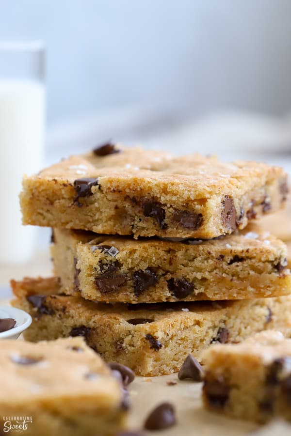 Three chocolate chip cookie bars stacked on top of each other.