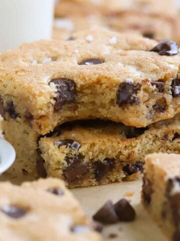 Two chocolate chip cookie bars stacked on top of each other.