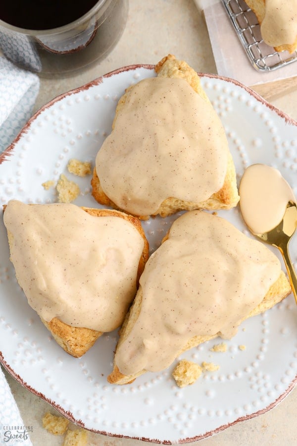 Three maple scones on a plate.