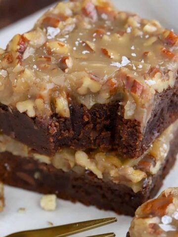 Stack of brownies with pecan topping