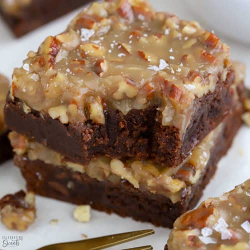 Stack of brownies with pecan topping