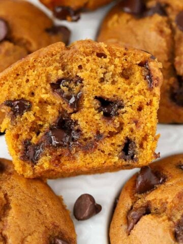 Closeup of pumpkin chocolate chip muffin cut in half