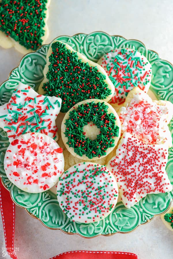 Green plate with christmas cookies on it