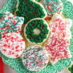 Cut out Christmas cookies on a green plate