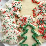 Cut out Christmas sugar cookies on a white plate