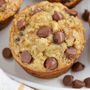 Close up of Banana Chocolate Chip Muffin on a white plate