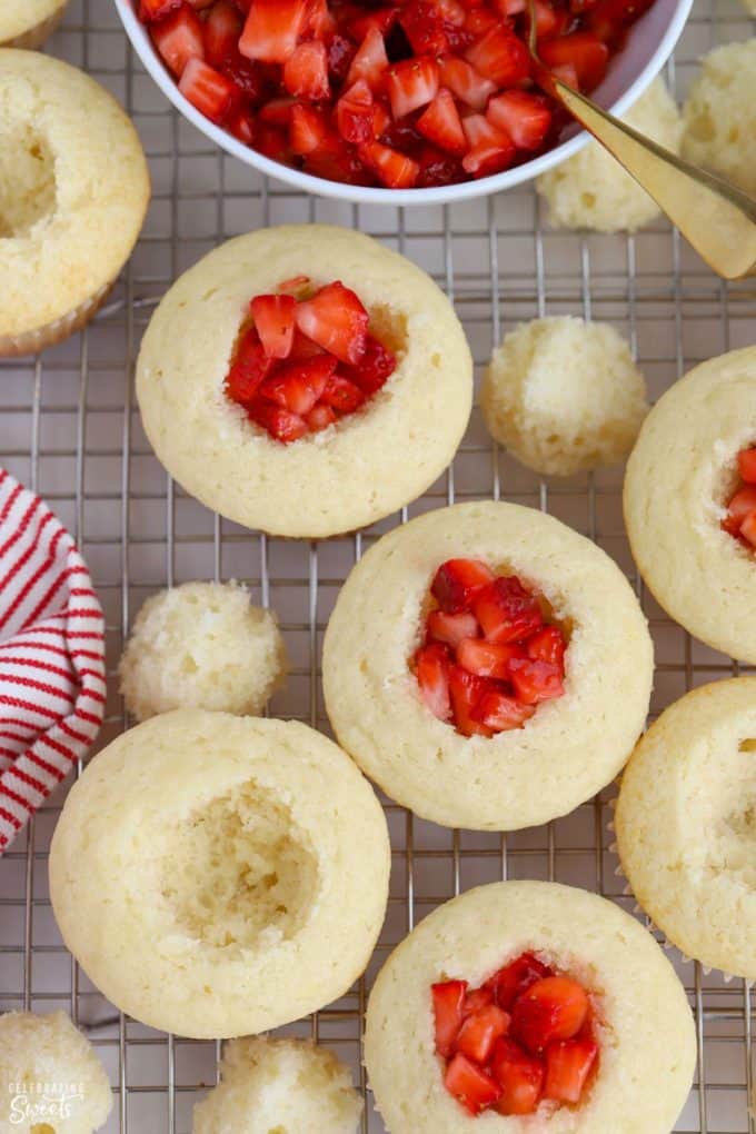 Vanilla cupcakes with strawberry filling inside