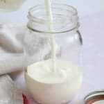 Milk being poured into a jar
