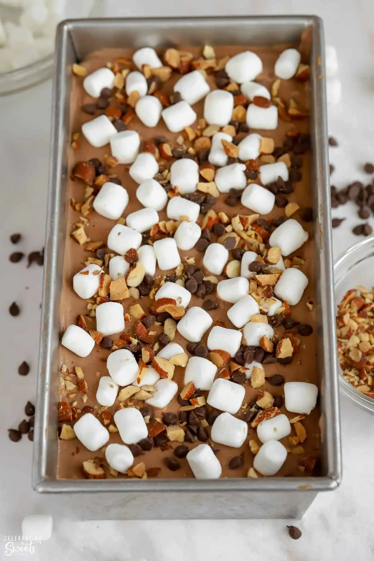 Rocky road ice cream in a loaf pan.