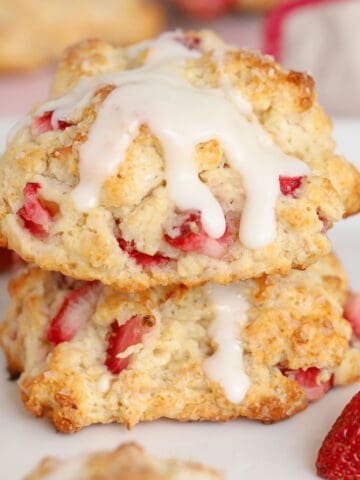 Two strawberry biscuits stacked on top of each other.