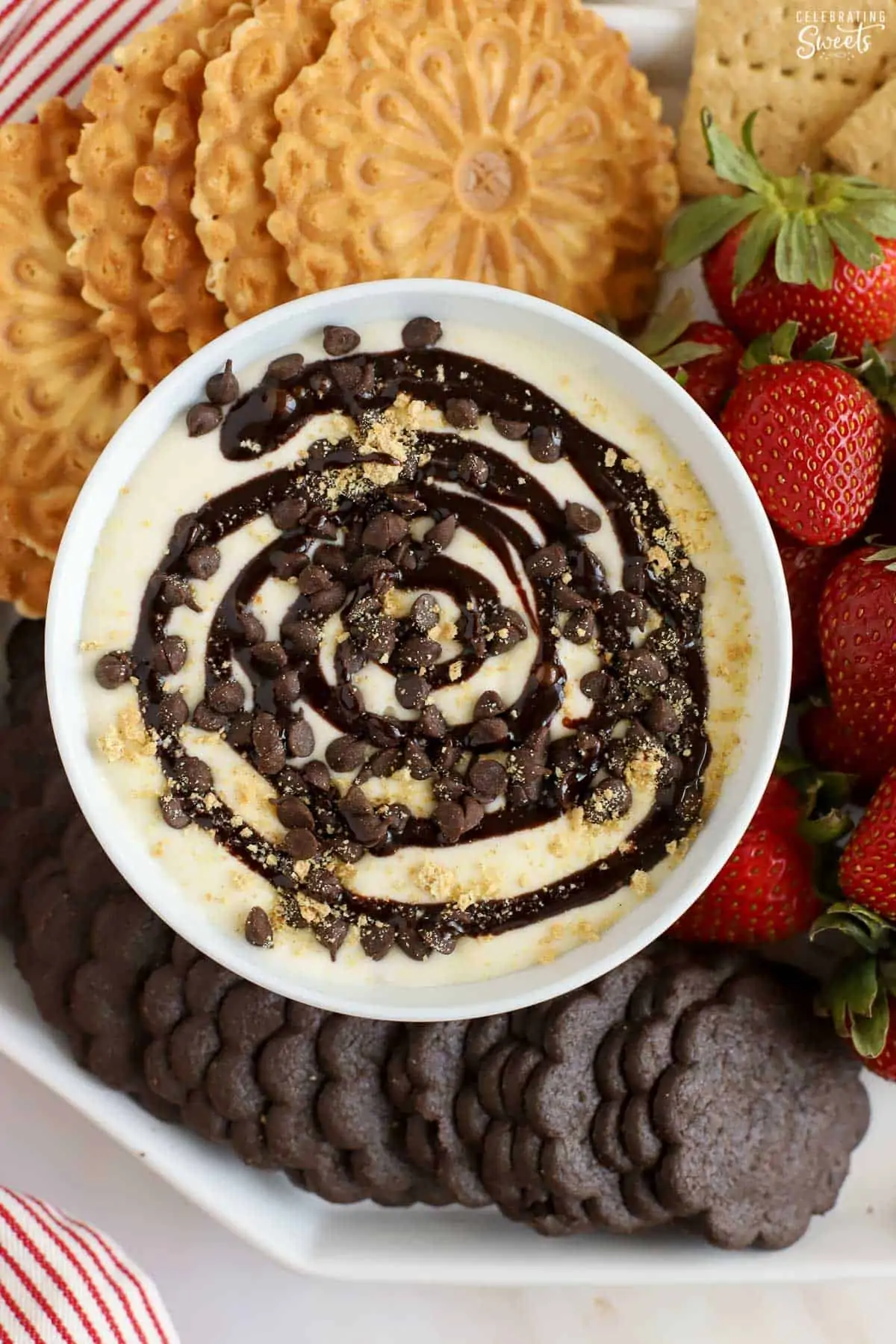 Cheesecake dip topped with chocolate swirls and chocolate chips