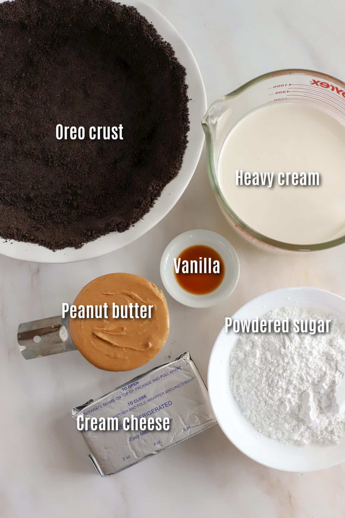 Ingredients to make peanut butter pie: cream, cookie crust, cream cheese, peanut butter, powdered sugar