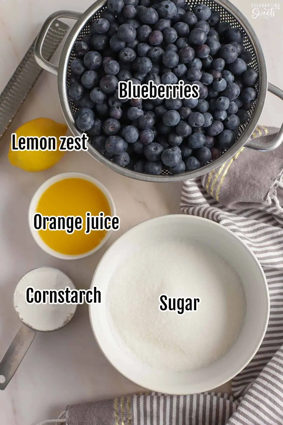 Ingredients for blueberry pie filling: blueberries, cornstarch, juice, sugar, lemon.