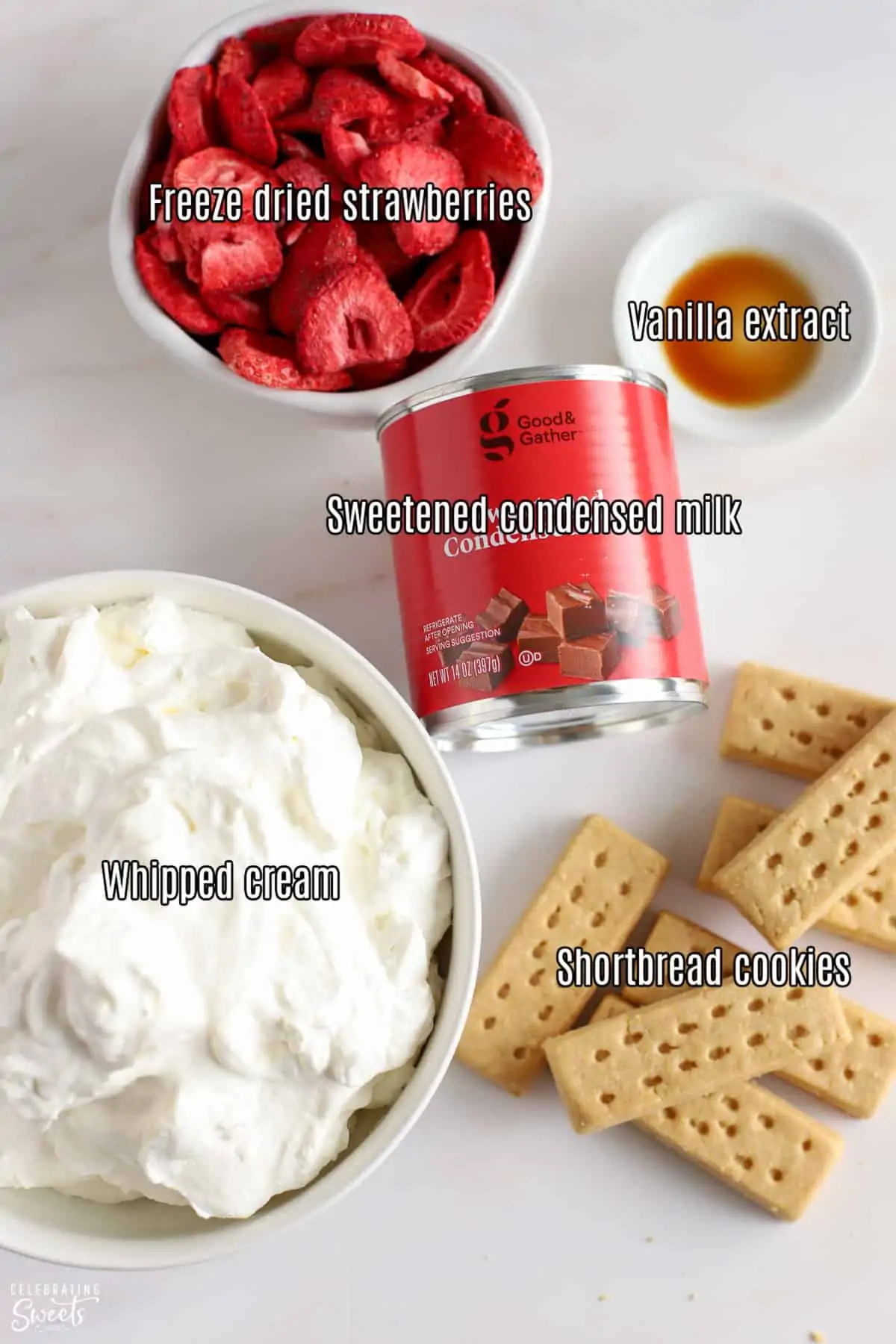 Ingredients for strawberry shortcake ice cream: cream, cookies, strawberries, sweetened condensed milk