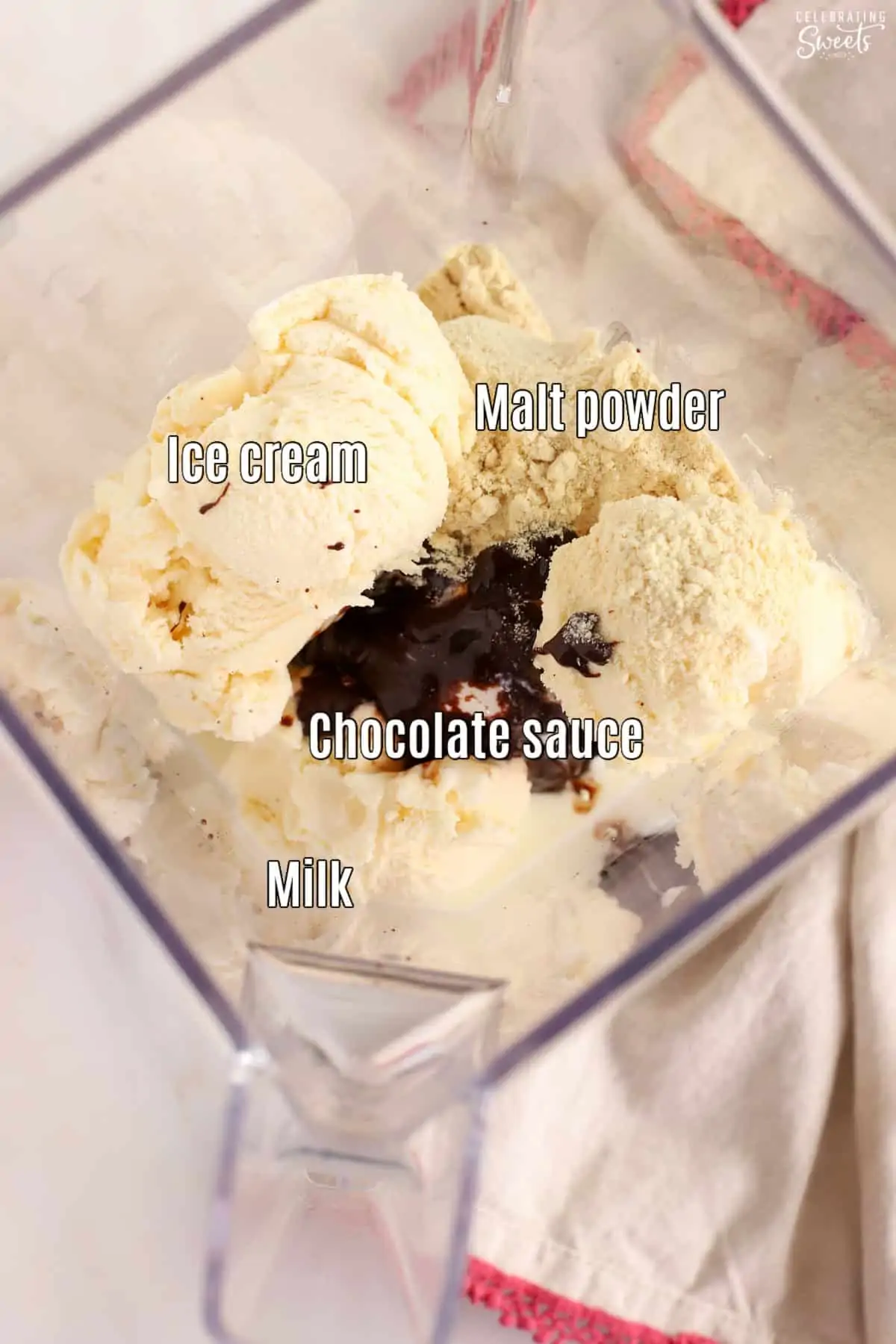 Ingredients for a chocolate malt in a blender: ice cream, chocolate sauce, malt powder, milk.