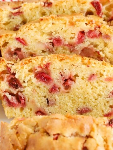 Slices of strawberry bread on a white plate.