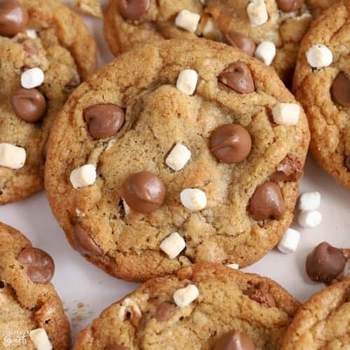 Closeup of s'mores cookies topped with chocolate chips and marshmallows