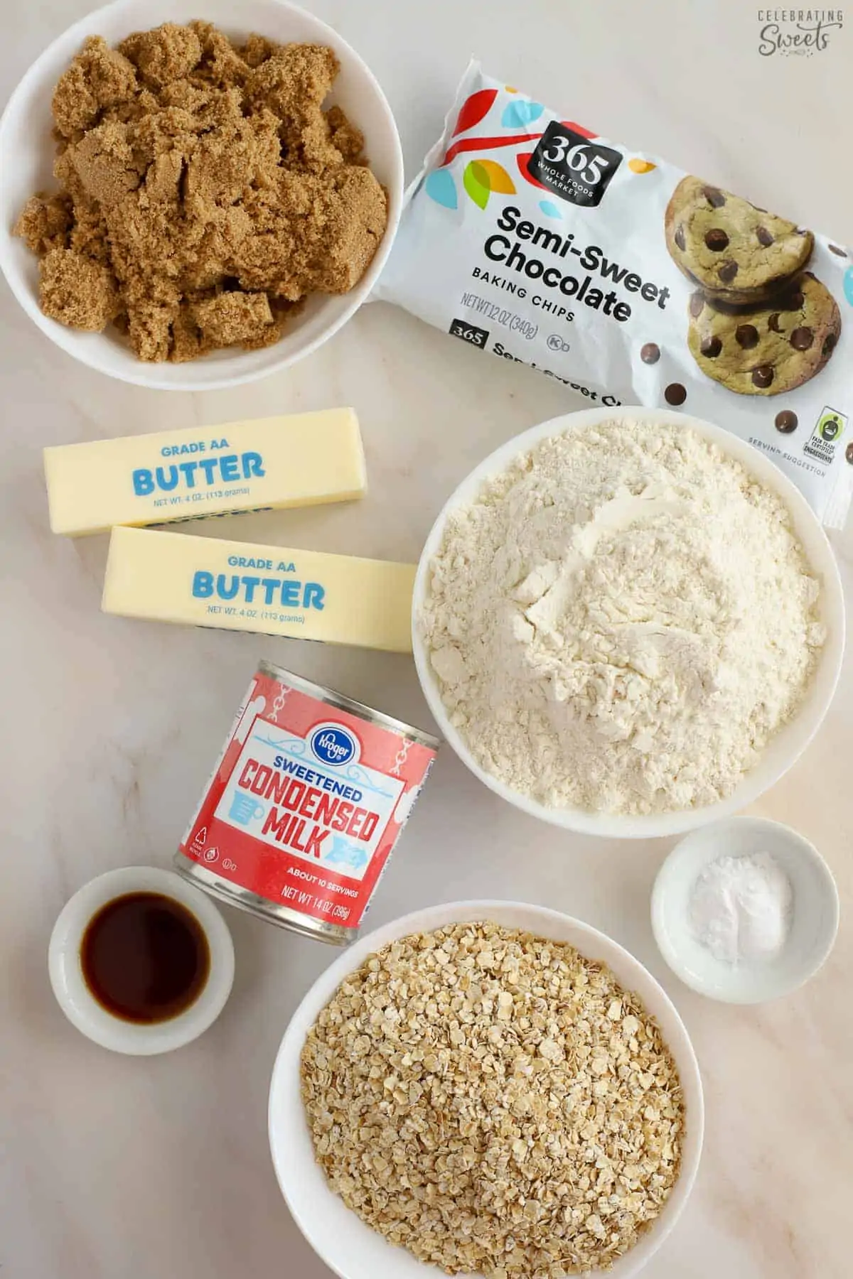 Ingredients for Oatmeal Fudge Bars - Oats, flour, brown sugar, condensed milk, chocolate chips, butter, vanilla.