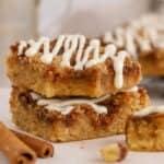 Two cinnamon roll blondies stacked on top of each other.