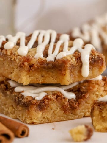 Two cinnamon roll blondies stacked on top of each other.