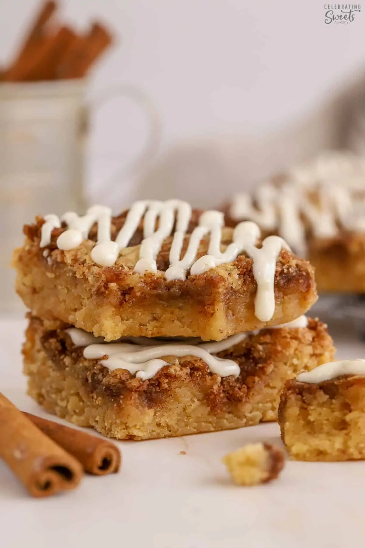 Two cinnamon roll blondies stacked on top of each other.