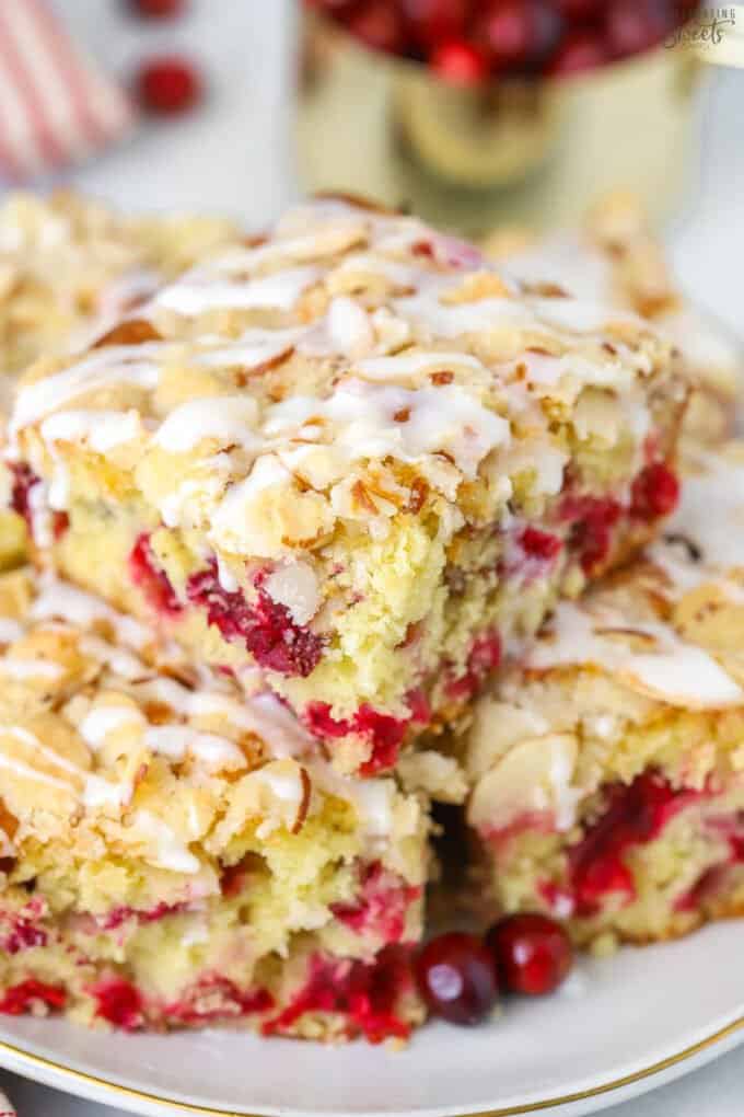 Stack of slices of cranberry cake on a grey plate