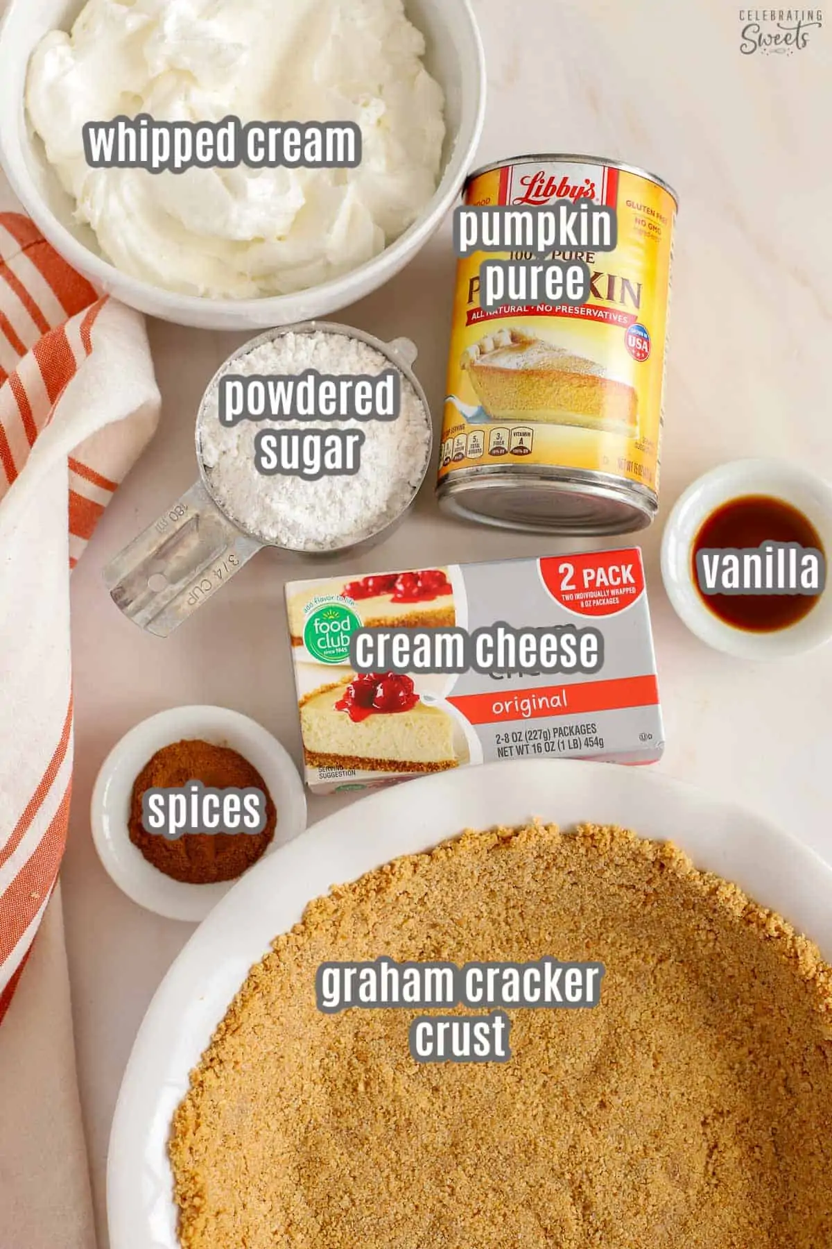 Ingredients for pumpkin pie cheesecake: cream cheese, pumpkin, crust, whipped cream, spices, sugar, vanilla.
