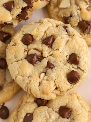 Almond joy cookies on parchment paper.